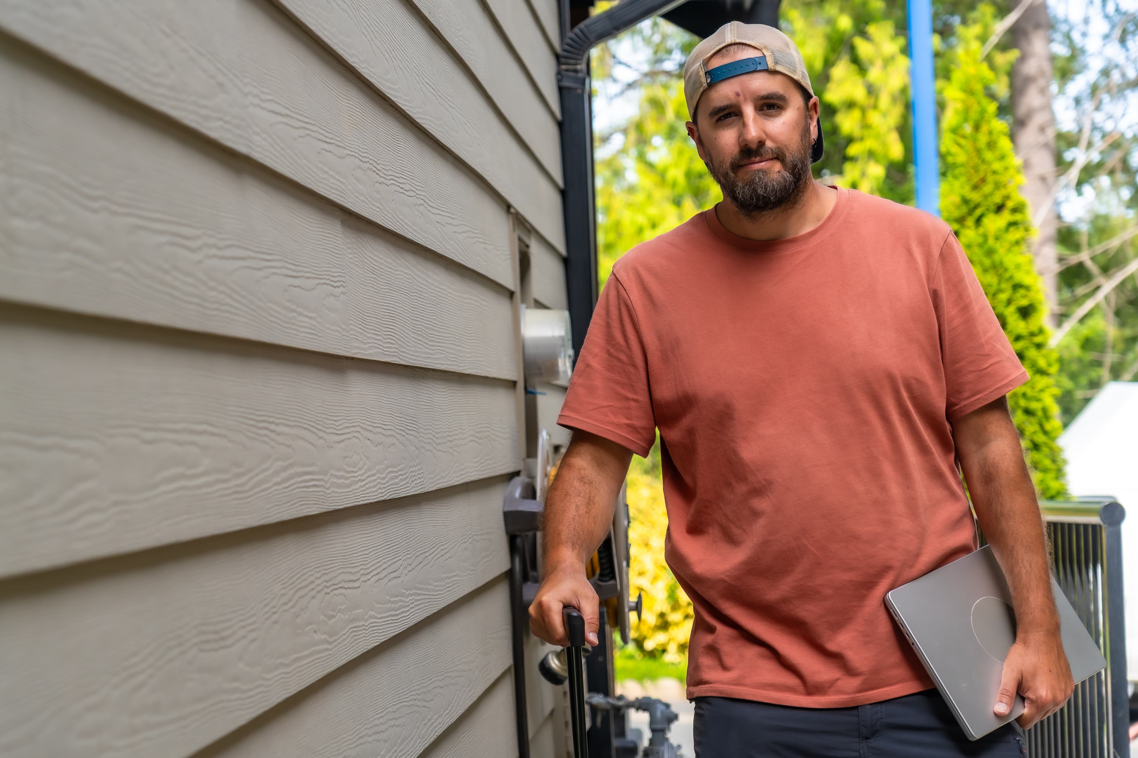 Roofing contractor inspecting and documenting roof condition with a clipboard.